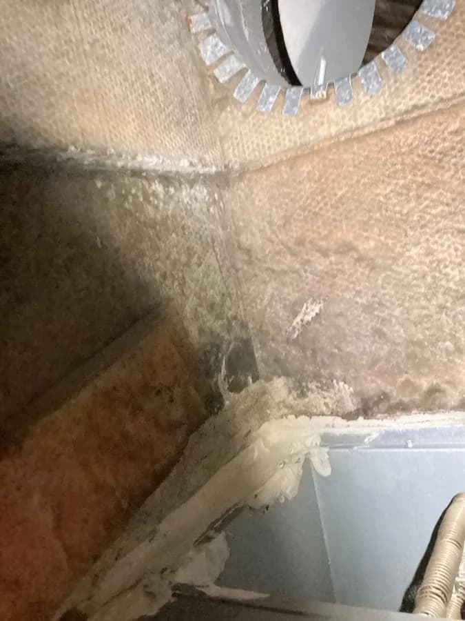 Interior duct connection and lined surfaces photographed during the assessment