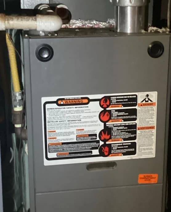 Indoor equipment cabinet and piping photographed during the condensate pump service visit